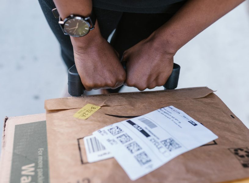 pexels-rdne-7362924 person with an amazon package