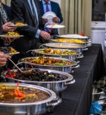 business people at a buffet