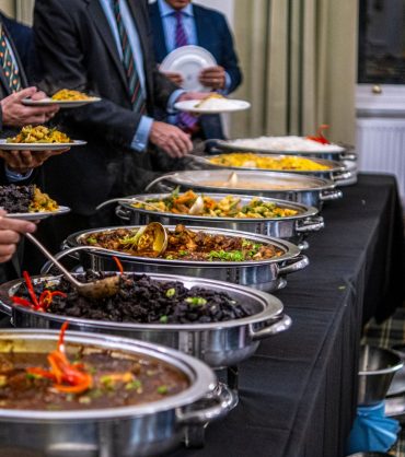 business people at a buffet